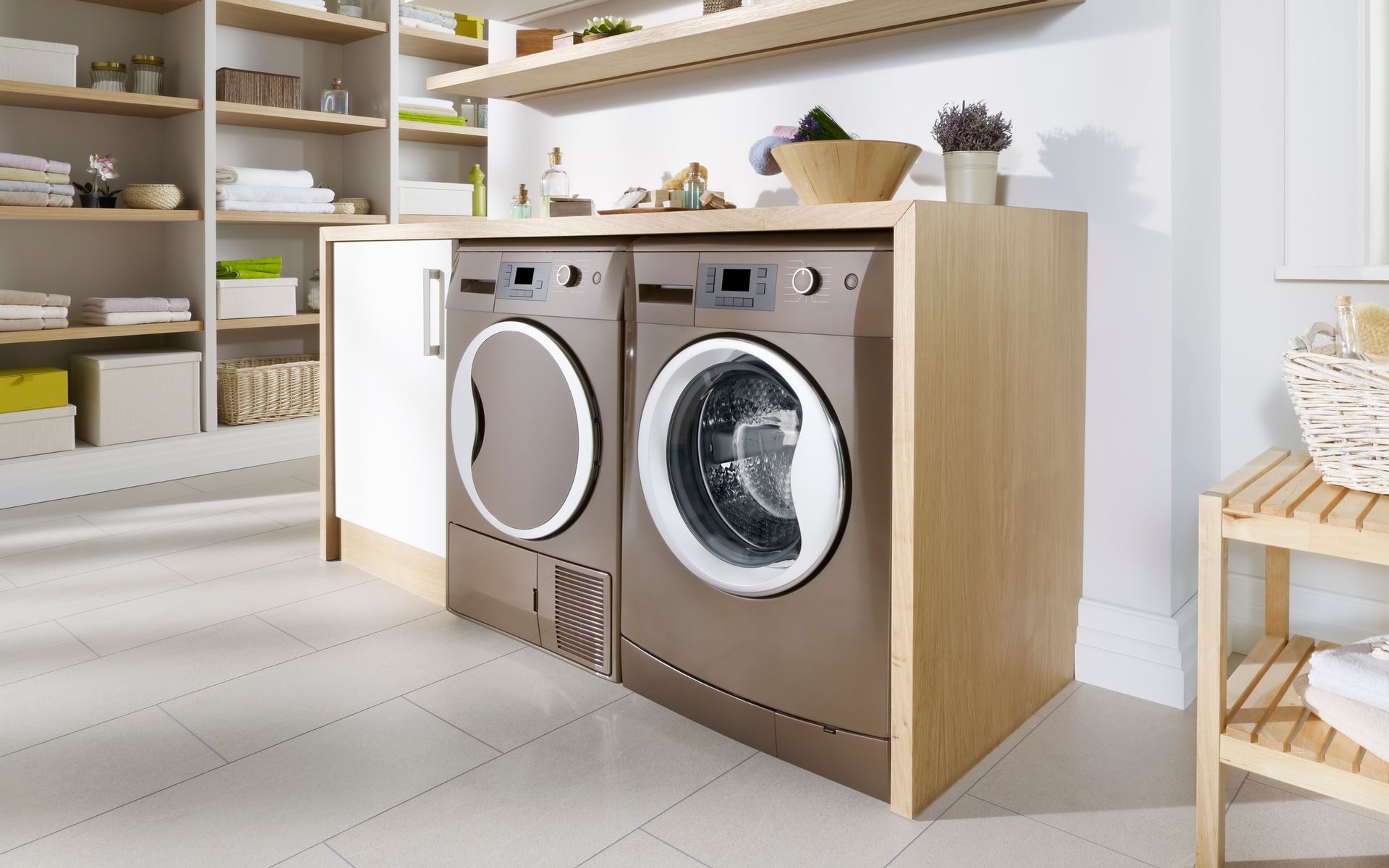 A laundry room with a washer and dryer on a counter.