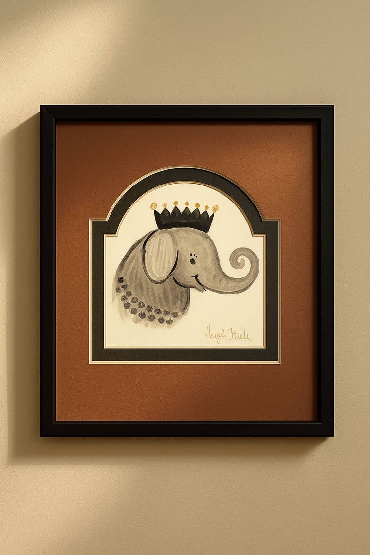A framed picture of an elephant wearing a crown