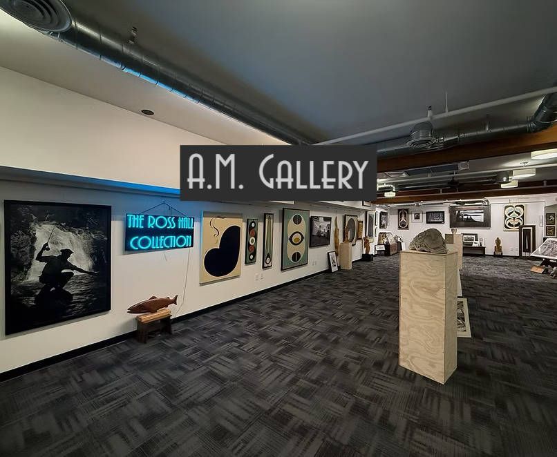 A large room with a sign that says a.m. gallery
