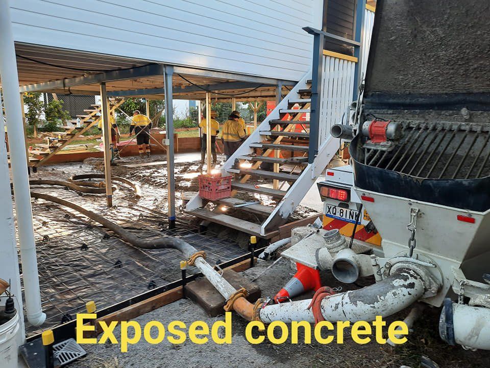 Exposed concrete is being pumped into a building under construction