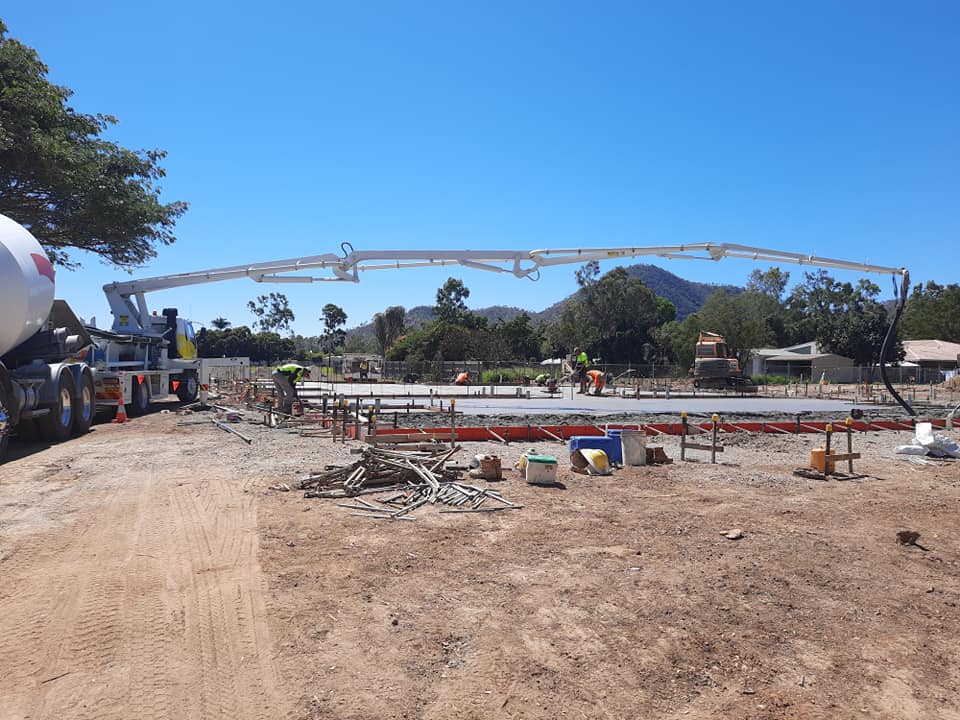 Concrete pumping machinery on job site — Gallery in Townsville, QLD