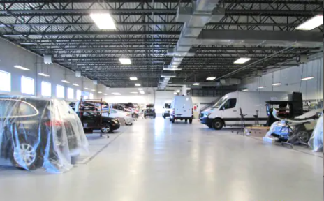 White Van And Cars Parked - Mechanicsburg, PA - Sun Motors Collision Center