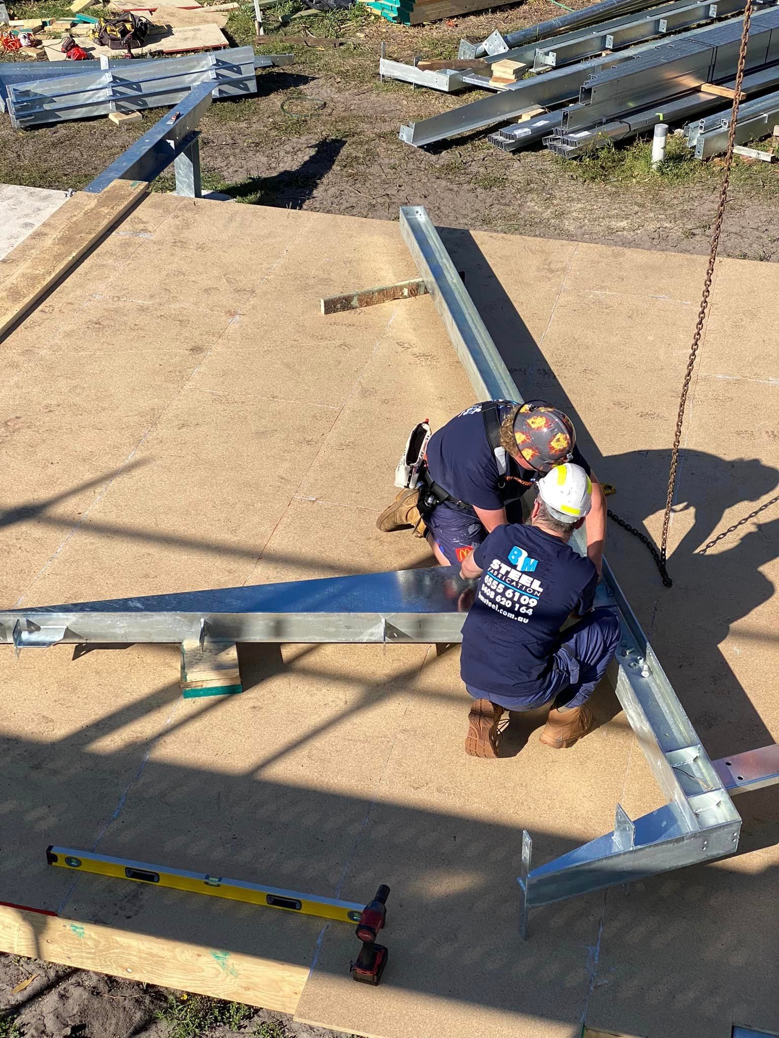 Man Cutting Steel Parts — BM Steel Fabrication In Forster, NSW