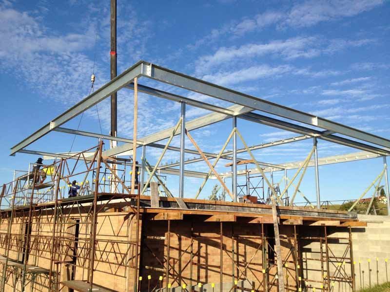 A Building Under Construction With A Blue Sky In The Background — BM Steel Fabrication In Forster, NSW