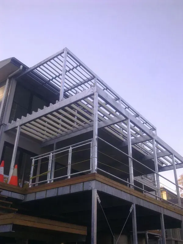 A Large Building With A Balcony And A Roof — BM Steel Fabrication In Forster, NSW