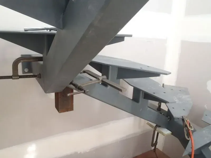 A Close Up Of A Metal Staircase Being Built — BM Steel Fabrication In Forster, NSW