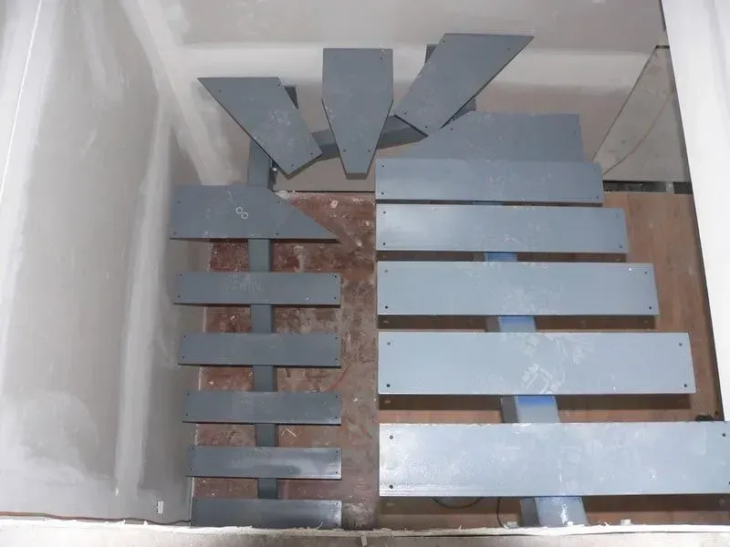 A Staircase Is Being Built In A Corner Of A Room — BM Steel Fabrication In Forster, NSW