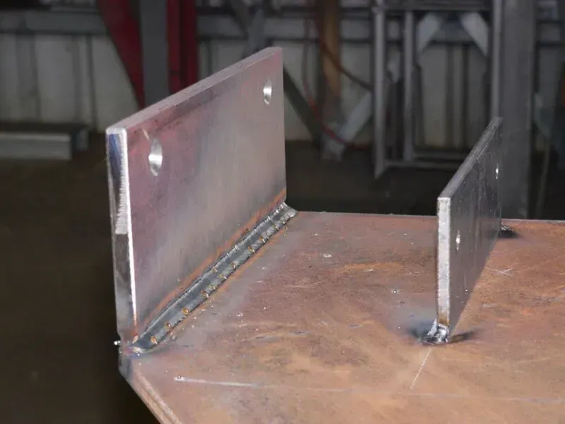 A Piece Of Metal Is Sitting On Top Of A Table — BM Steel Fabrication In Forster, NSW