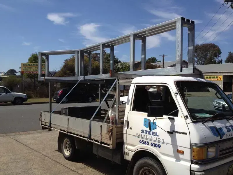 A White Truck With The Word Steel On The Side — BM Steel Fabrication In Forster, NSW