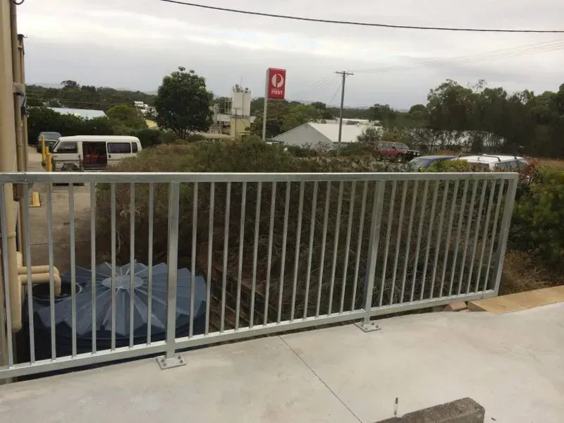 A Fence With A Post Office Sign In The Background — BM Steel Fabrication In Forster, NSW