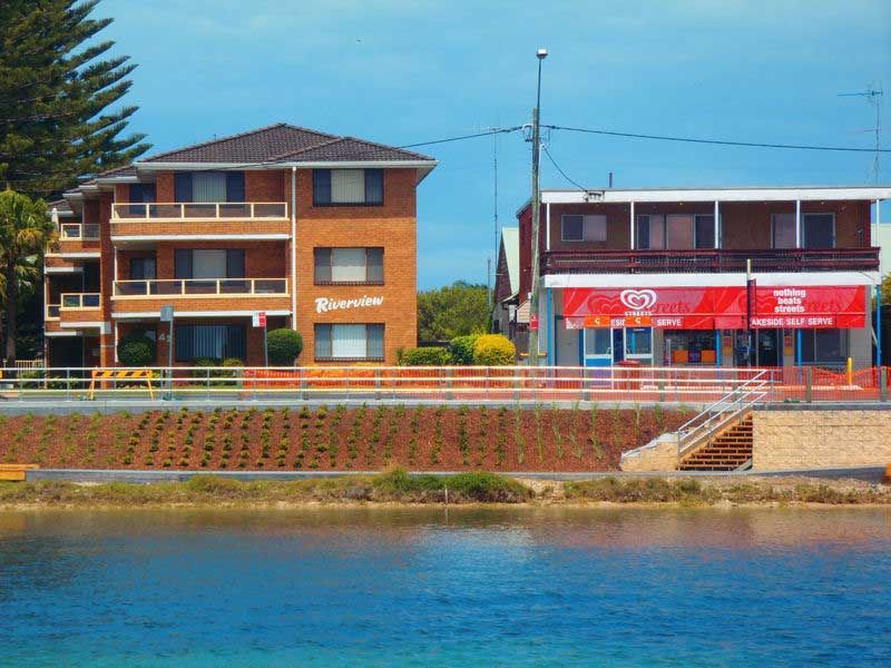 A Building With A Red Awning — BM Steel Fabrication In Forster, NSW