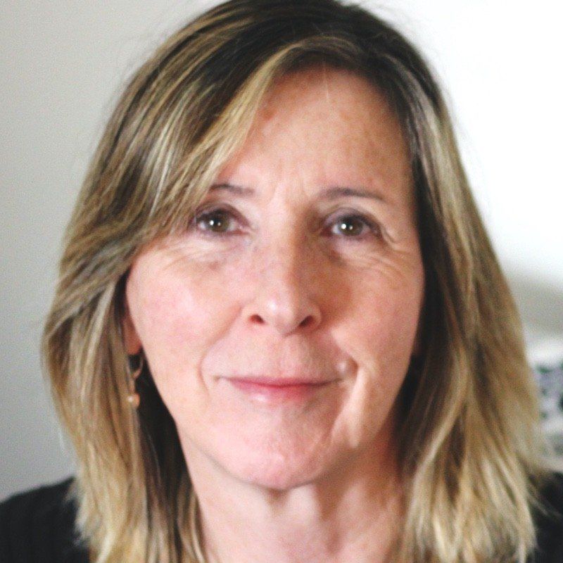 A close up of a woman 's face with blonde hair