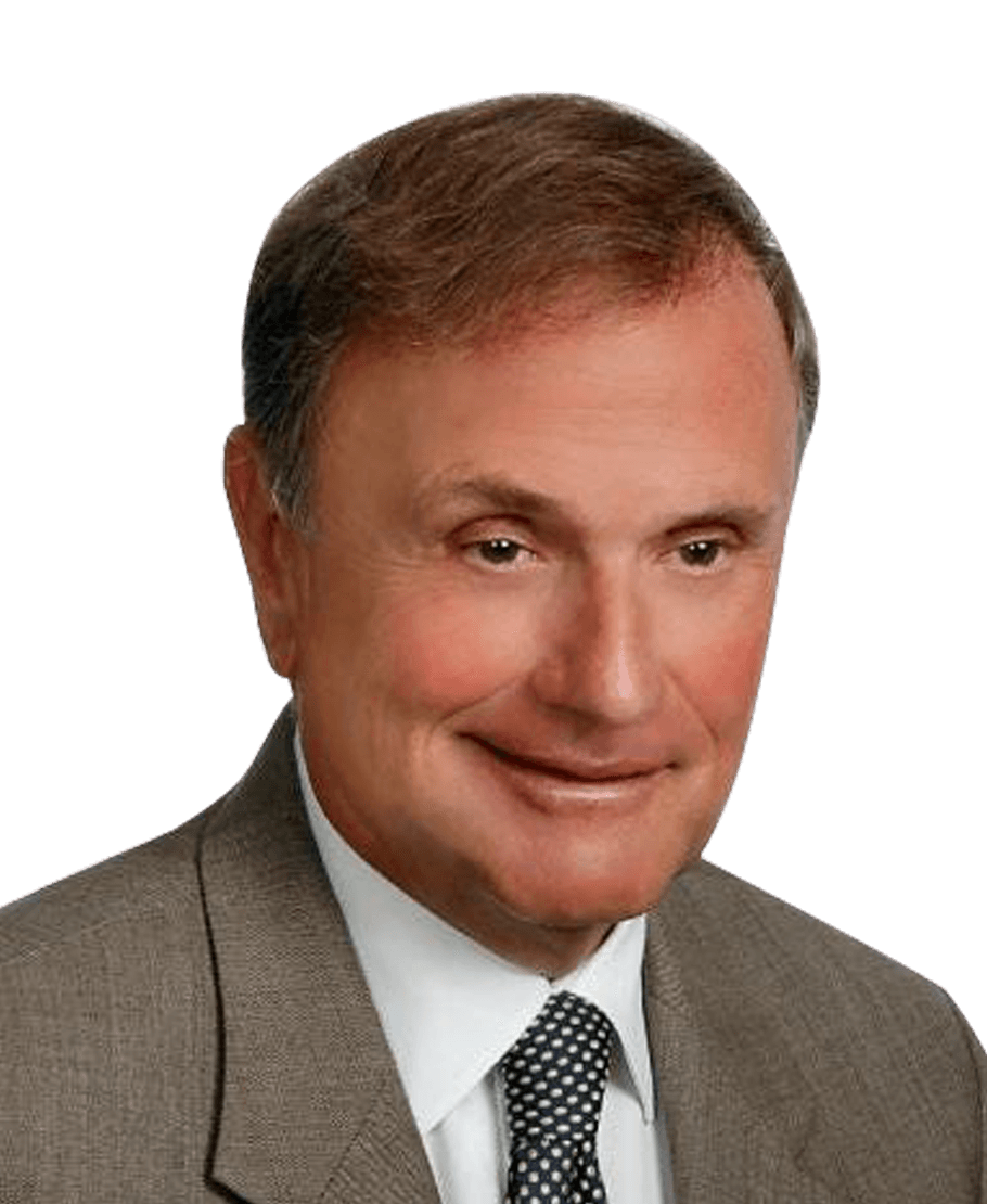 A man in a suit and tie is smiling for the camera.