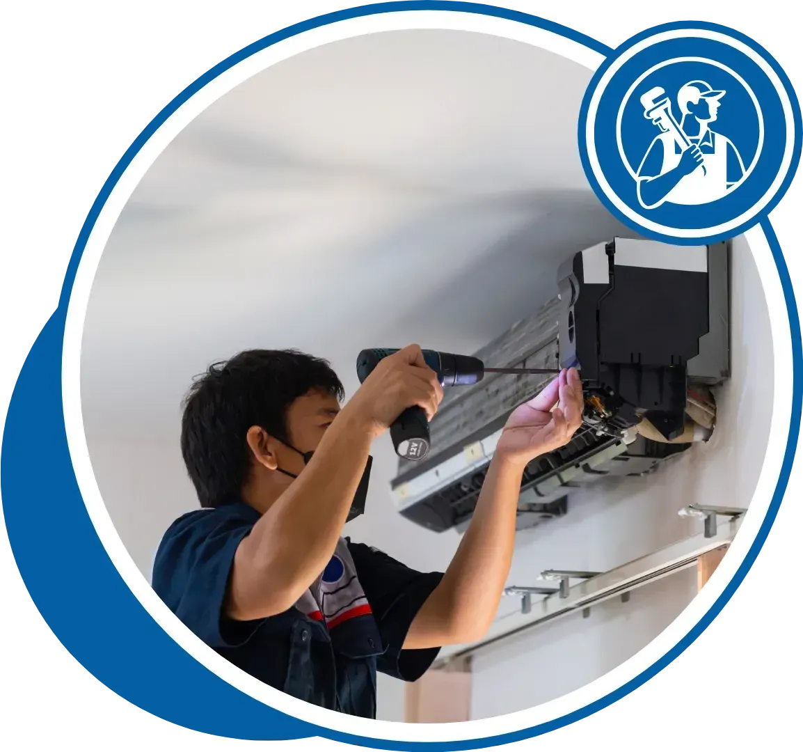 HVAC technician in a face mask working on an air conditioning unit with a screwdriver.