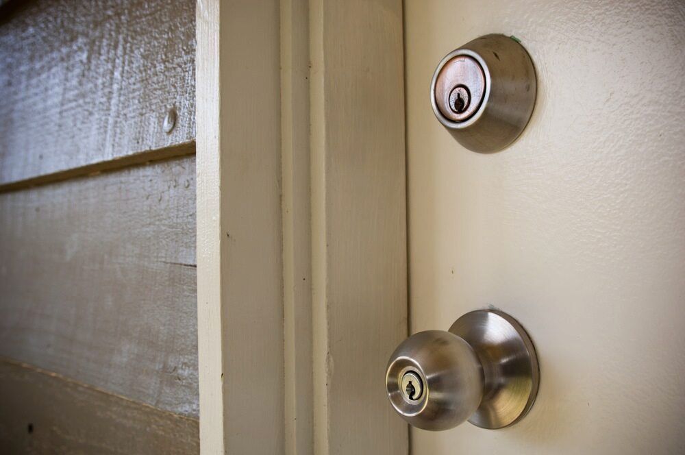 A Door Knob on a White Door — Shaine Hunter Locksmiths in Doomadgee, QLD