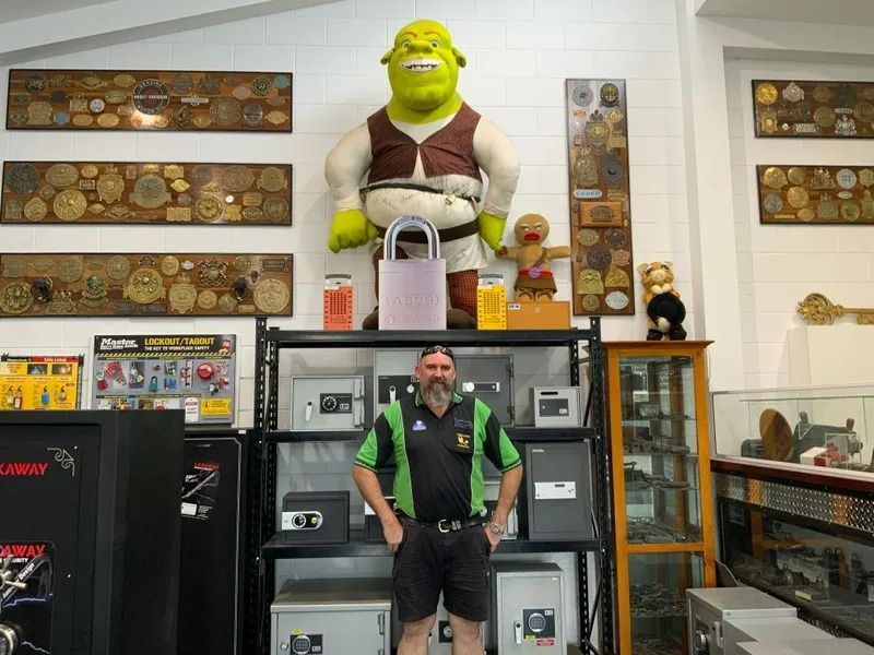 Man Standing In front Of The Safe Box — Locksmith In Mount Isa, QLD