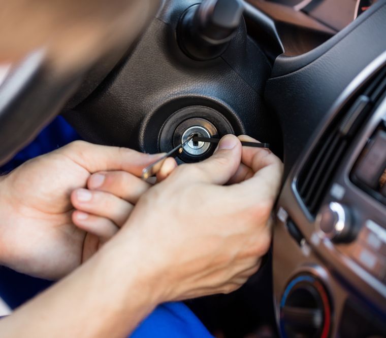 Man Hand Inserting Lockpickers Tools In Key Hole — Shaine Hunter Locksmiths in Mount Isa, QLD