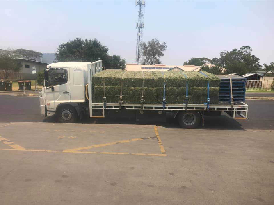Truck With Hay Bales — Agricultural Supplies in Scone, NSW