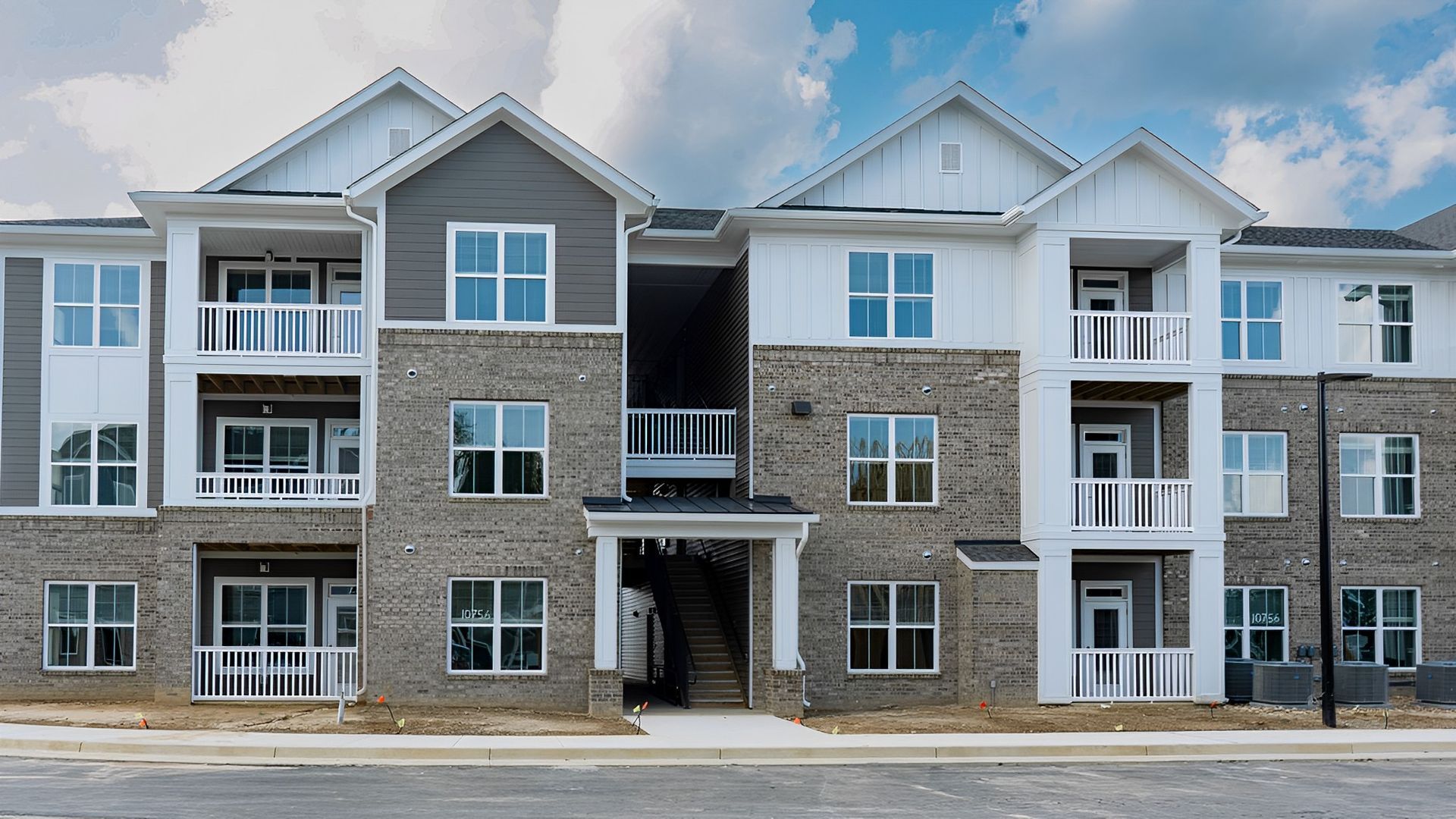 A Large Apartment Building With a Lot of Windows and Balconies
