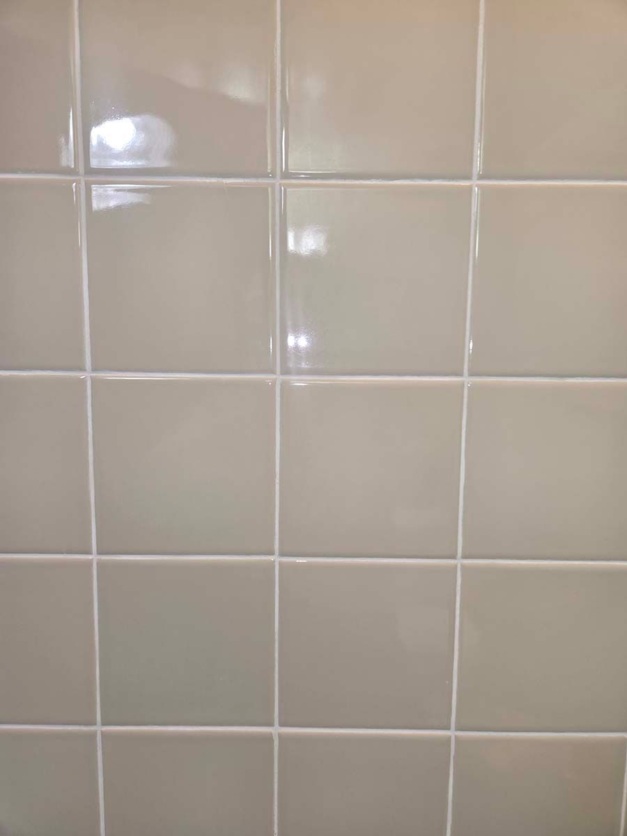 Close-up on regrouting shower tile