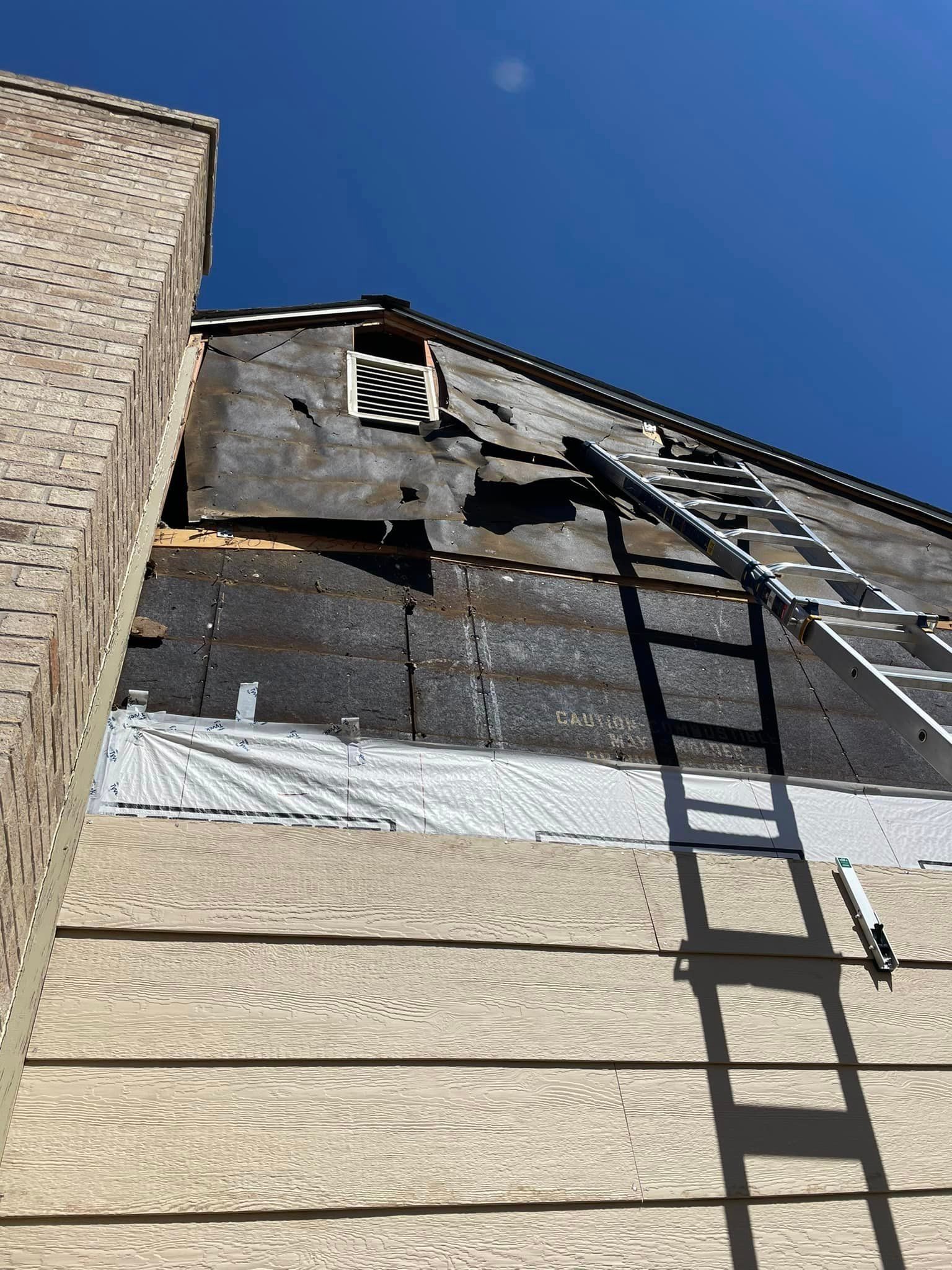 A ladder is attached to the side of a building.