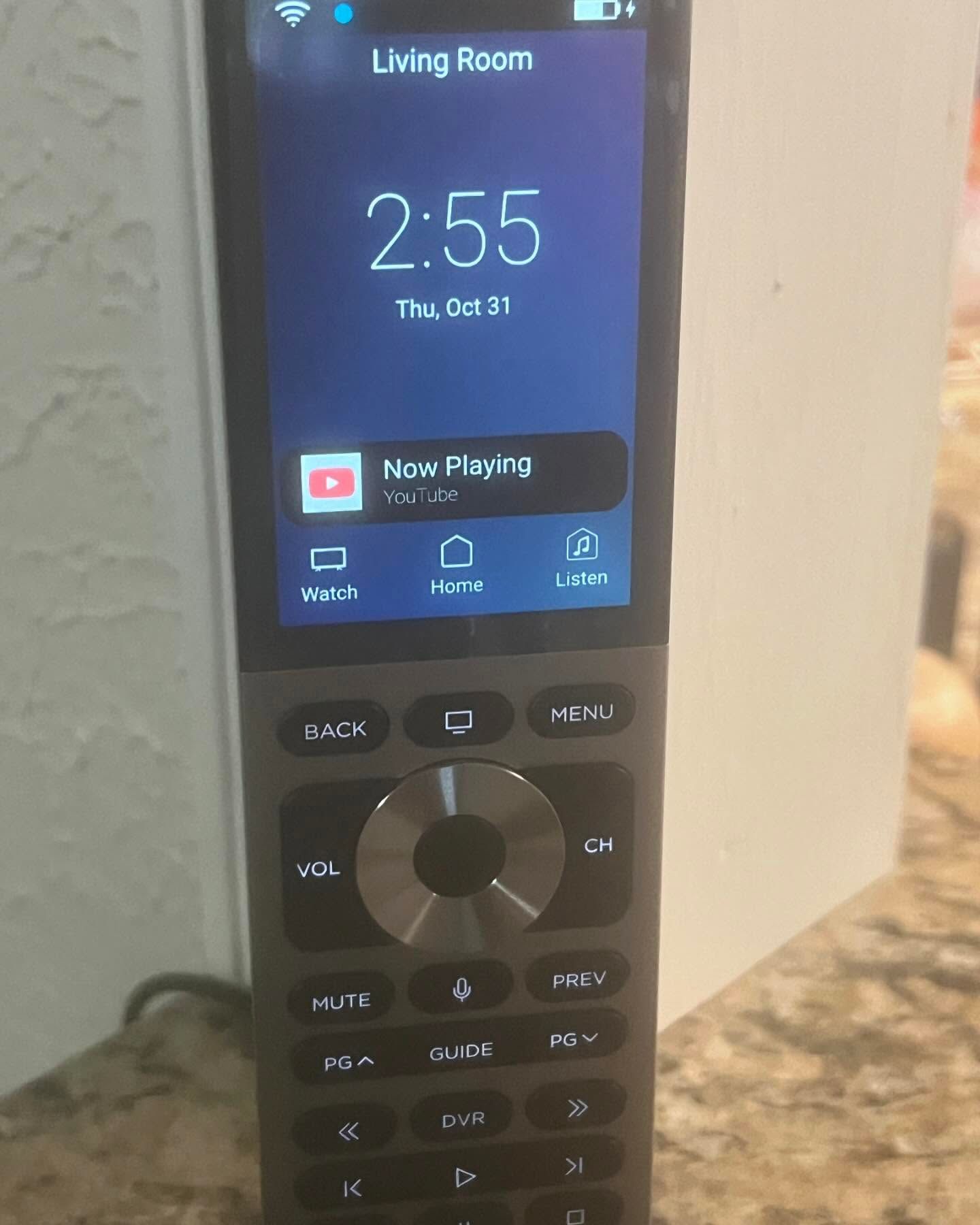 A cell phone with the time of 2:55 on the screen
