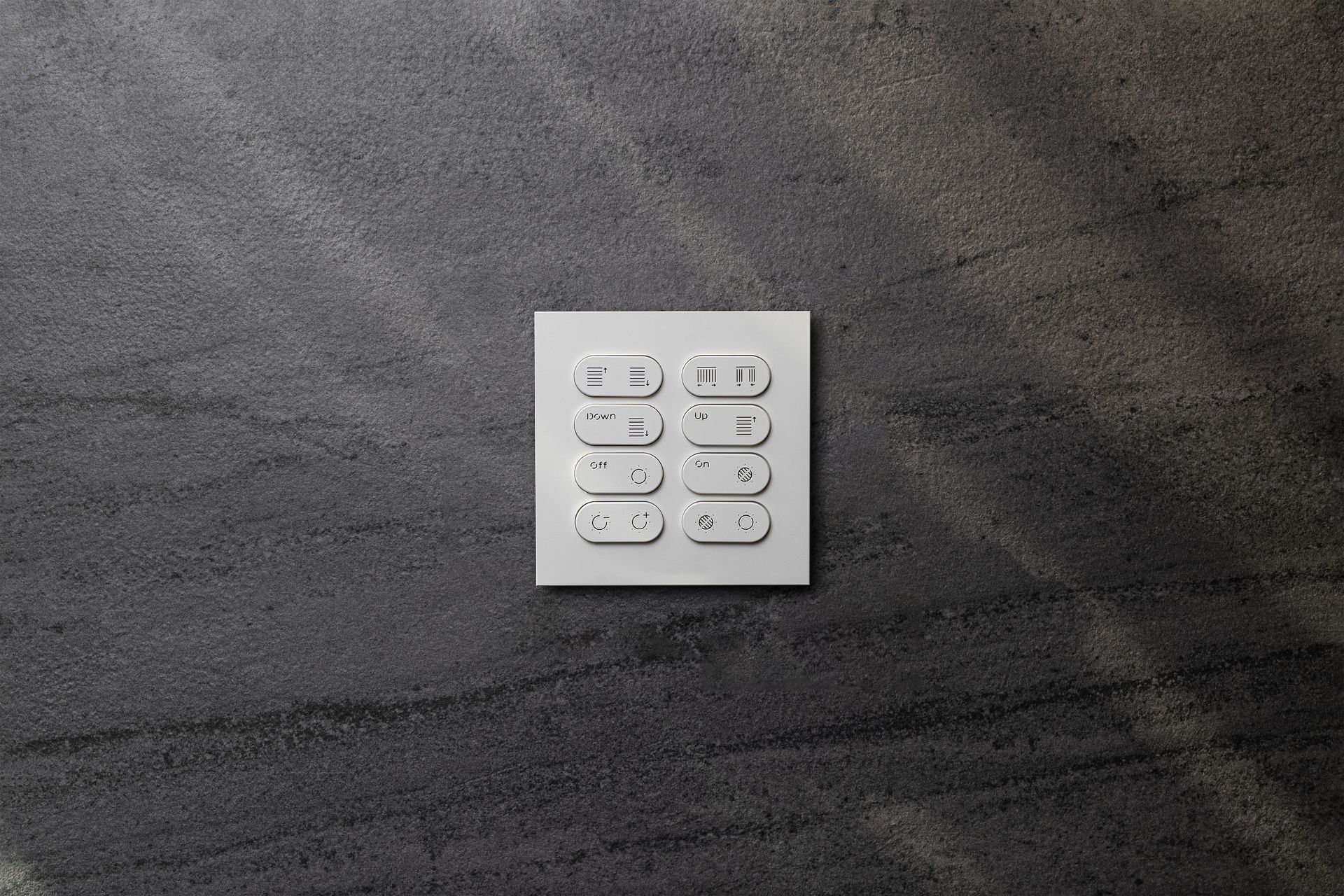 A close up of a white electrical outlet on a gray wall.