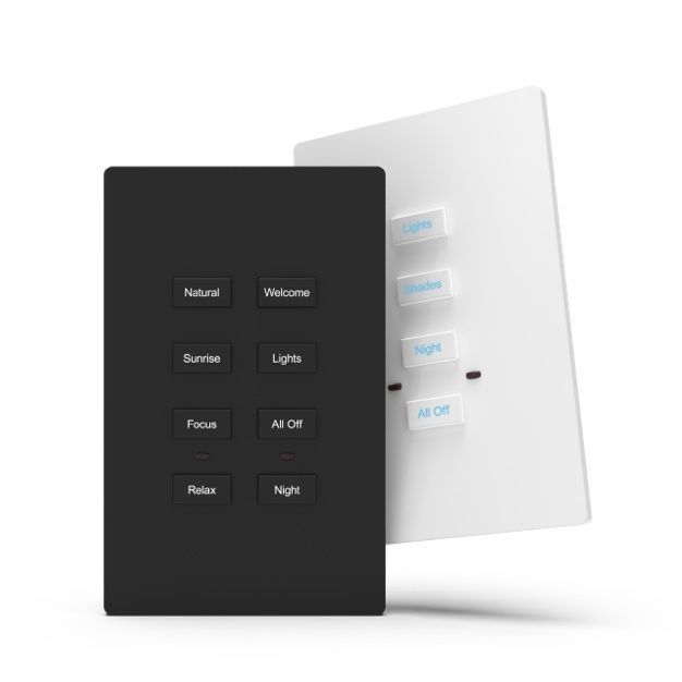 A black and white remote control is sitting on top of a white wall.  services.