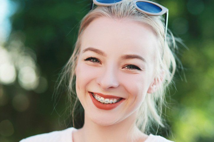 Smiling girl wearing braces smiling girl wearing braces
