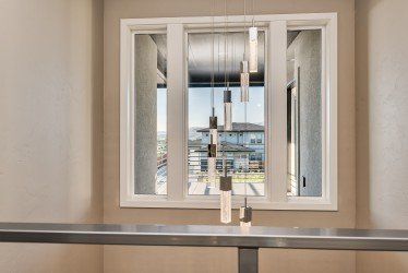 Light fixtures hanging by window - General Contractor in East Boise, ID