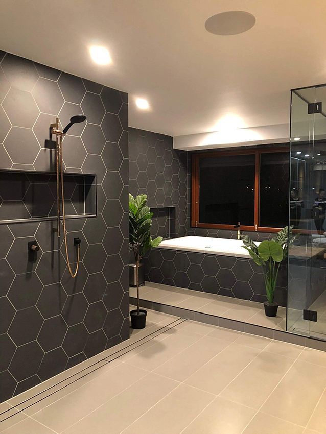 A Modern Bathroom With Dark Hexagonal Tiles — Michael Duncan Constructions Pty Ltd in Robina, QLD