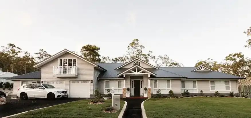A Light-colored Suburban House With a Dark Roof — Michael Duncan Constructions Pty Ltd in Robina, QLD