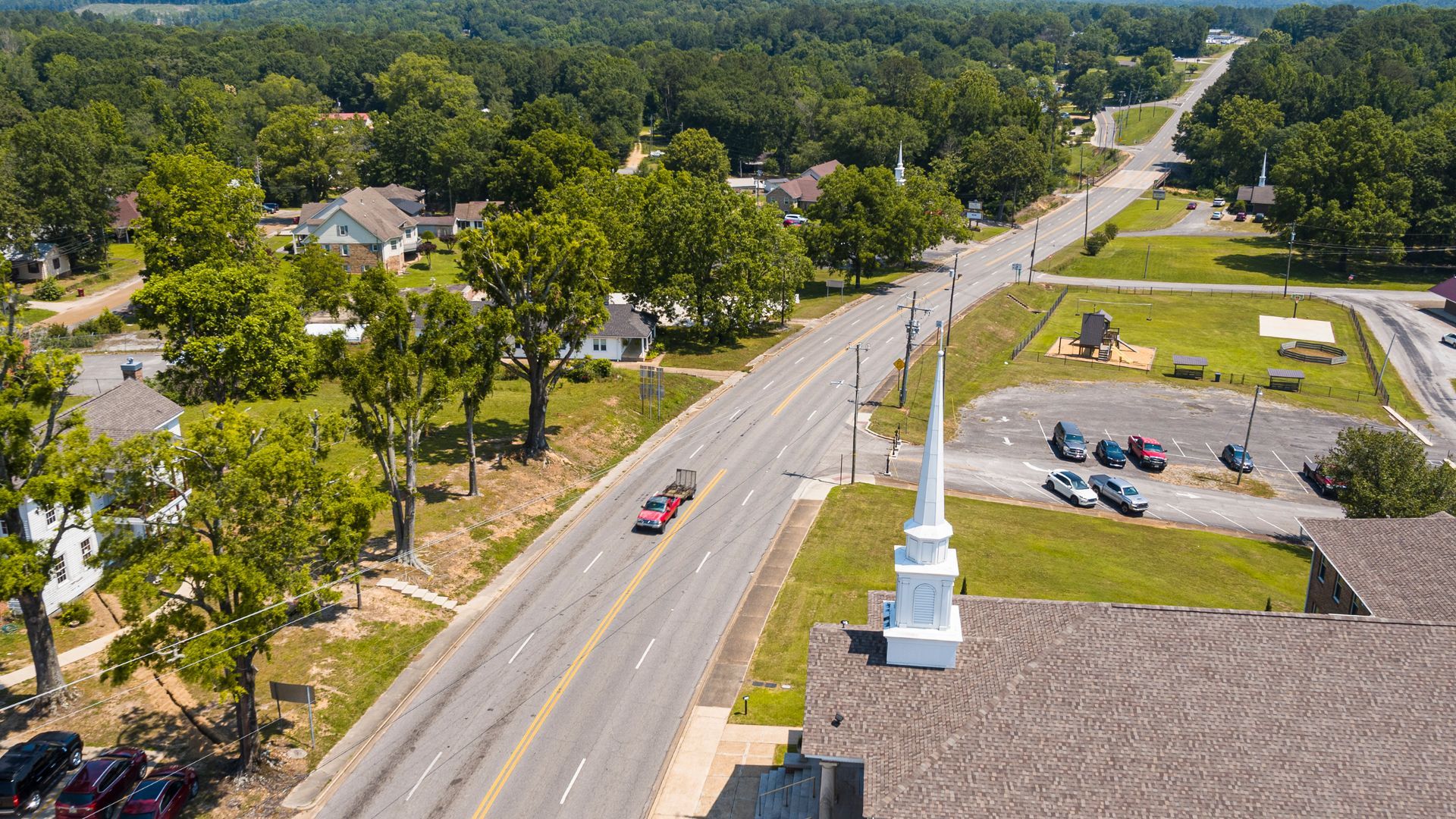 A row of caravans are parked in a greenhouse.