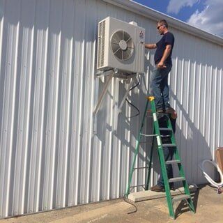Repairing Aircon Outdoor Unit — Commercial HVAC Contractors in Mount Vernon, OH