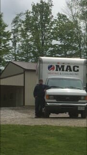 Man Beside Truck — HVAC Contractors in Mount Vernon, OH