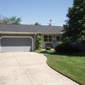 A House With A Garage And A Bench In Front Of It - Ravenna, Ohio - PRCA