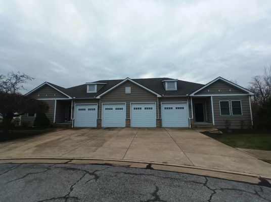 A House With Four Garage Doors And A Driveway - Ravenna, Ohio - PRCA