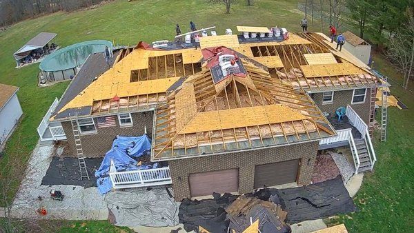 An Aerial View Of A House Under Construction With A Roof Being Installed - Ravenna, Ohio - PRCA