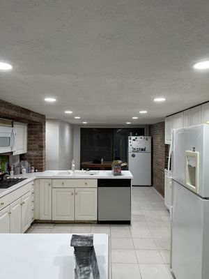 A Kitchen With White Cabinets , Stainless Steel Appliances , And A Refrigerator - Ravenna, Ohio - PRCA