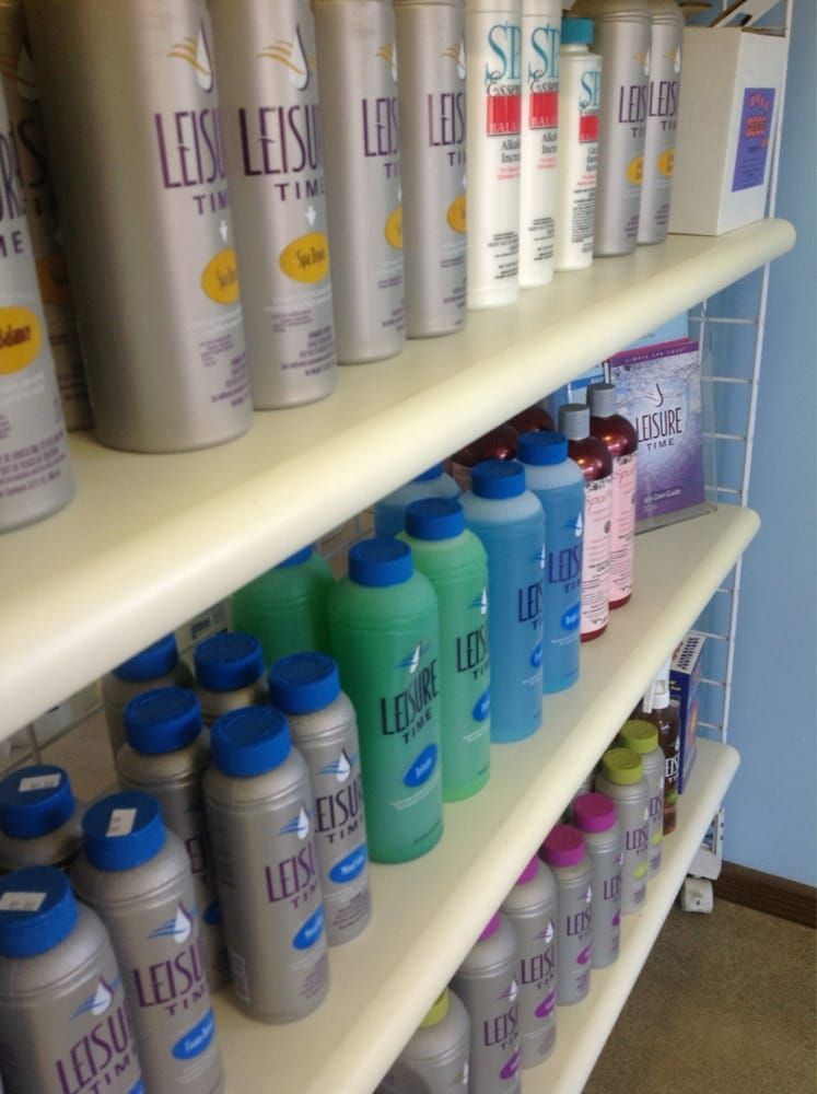 Shelves stocked with assorted colorful bottles and cans in a store aisle