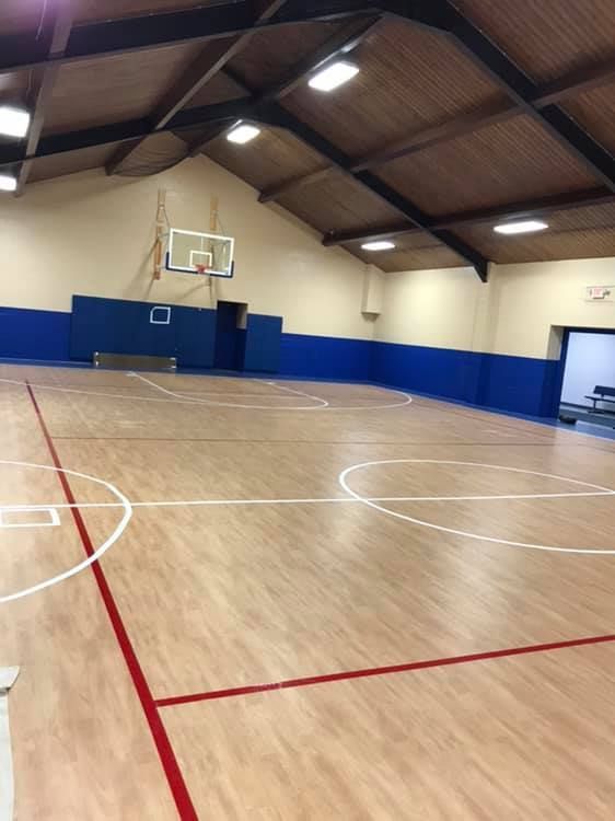 White French doors with multiple glass panes. Interior visible, including desk, lamps, and ceiling fan.