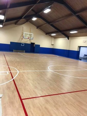 White French doors with multiple glass panes. Interior visible, including desk, lamps, and ceiling fan.