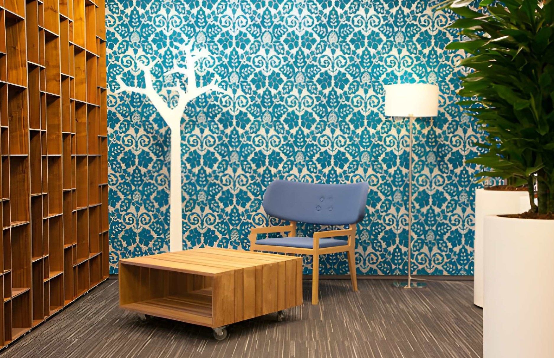 Modern office interior with brown leather sofa, desk, and abstract wall art.