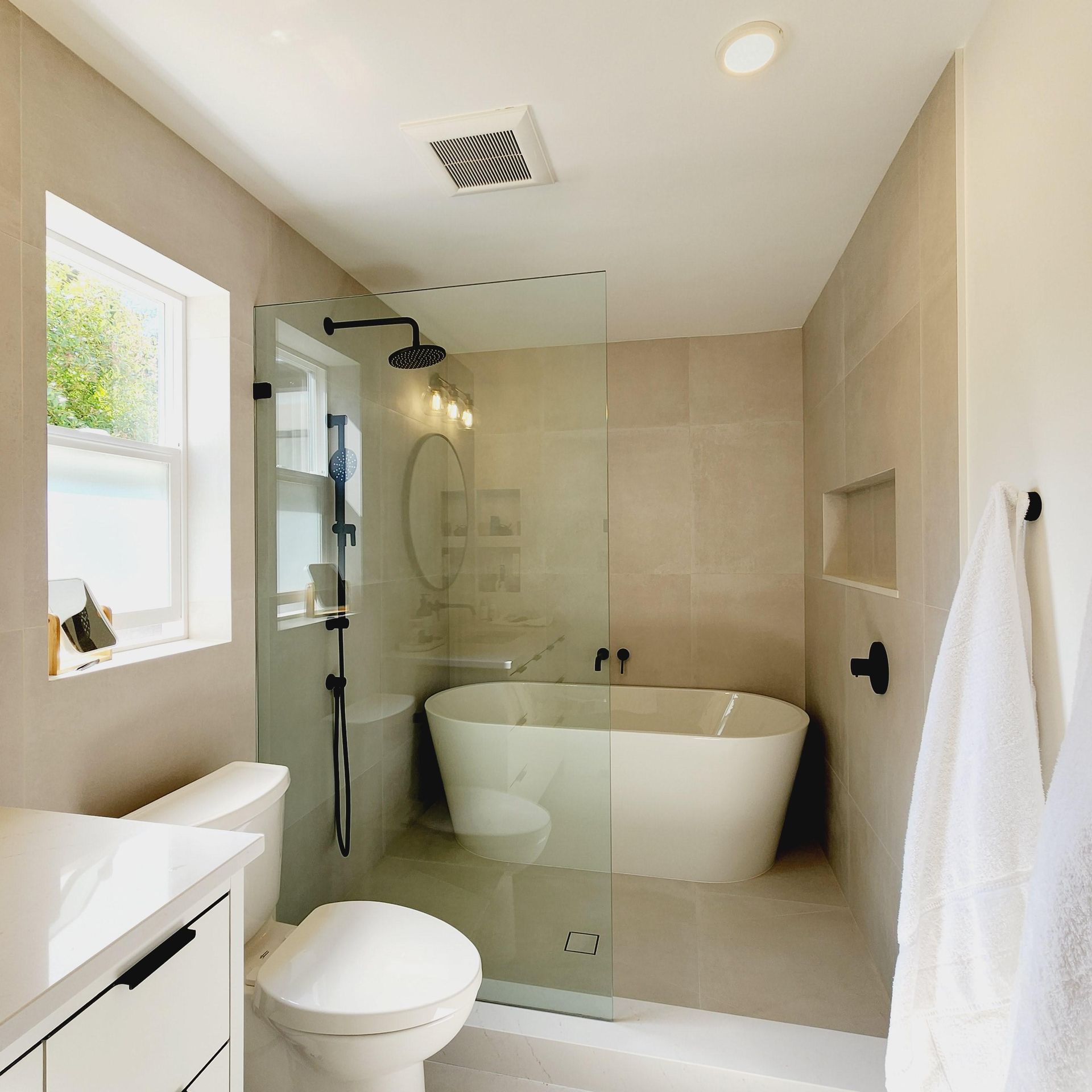 A bathroom with a bathtub toilet and sink