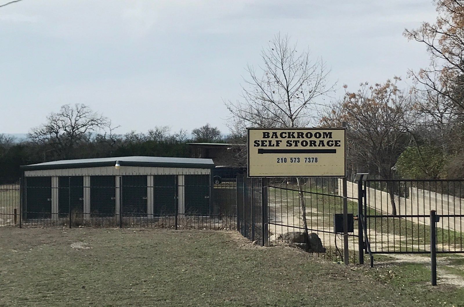 A man and a woman are standing next to each other in a storage room.