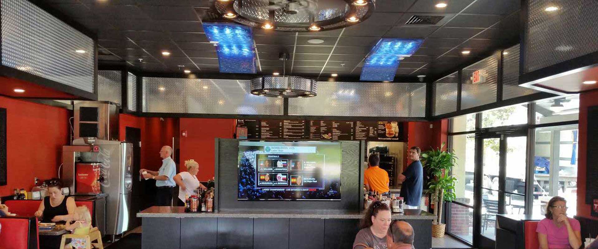 Robot touching a digital grid, head in profile; blue and white tones.