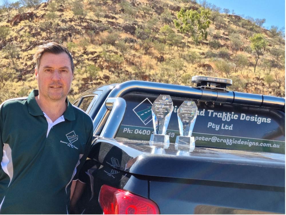 Peter Gurrie With Two Plaque Award On The Vehicle — Diamond Traffic Designs In Alice Springs NT