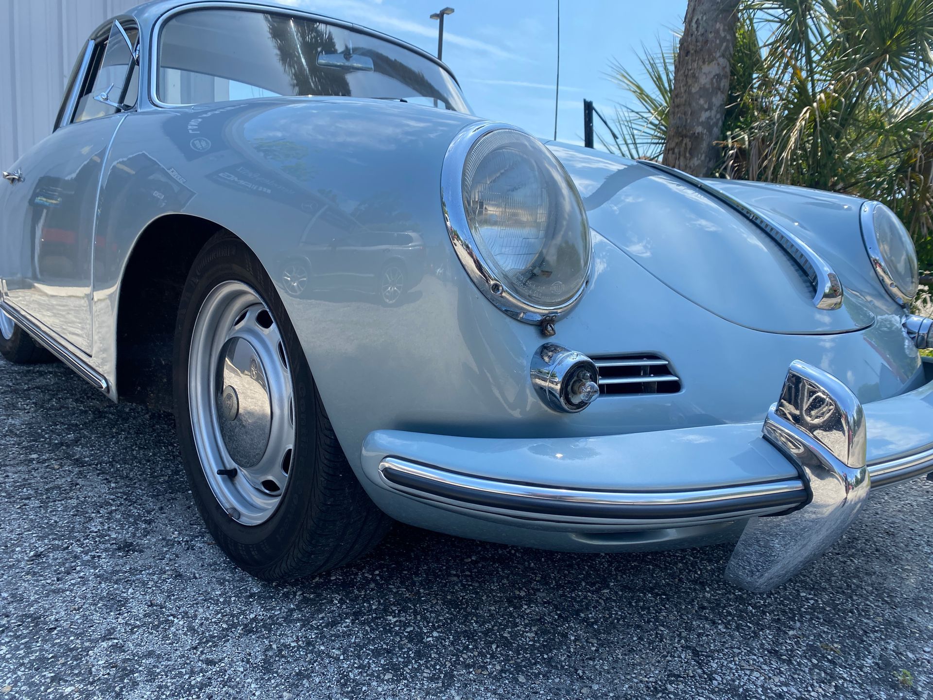 Light blue vintage Porsche coupe parked outside. | Velocity Motorwerks