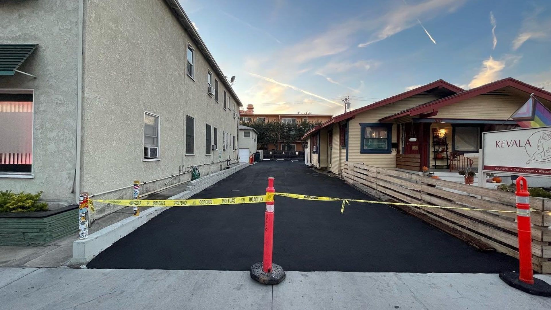 A parking lot is being built in front of a building.