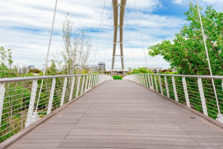 Wooden walkway spans cable bridge